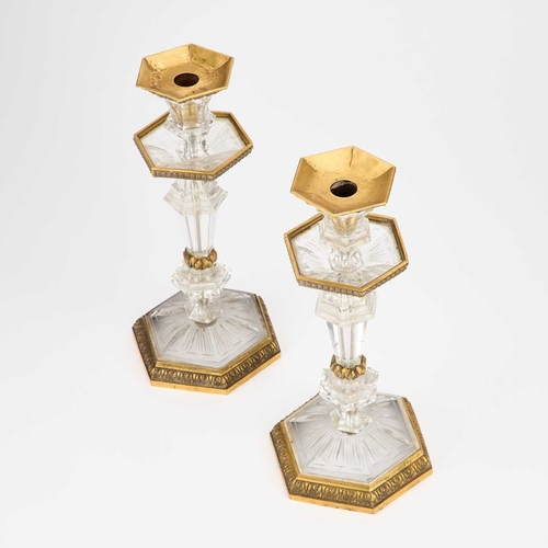 1042 - A FINE PAIR OF 19TH CENTURY CARVED ROCK CRYSTAL AND ORMOLU CANDLESTICKS hexagonal, with knopped stem... 