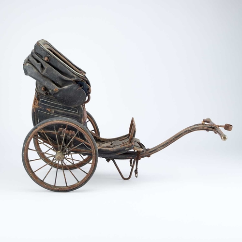 1057 - A VICTORIAN MINIATURE CART with an upholstered seat and folding canopy. 67cm long overall