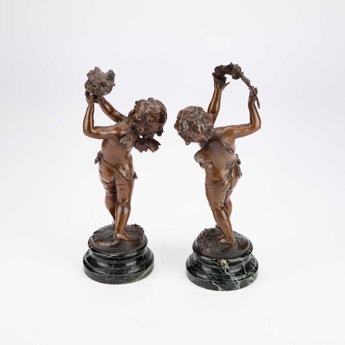 1070 - AFTER AUGUST MOREAU (FRENCH 1834-1917), A PAIR OF 19TH CENTURY PATINATED SPELTER PUTTI signed, raise... 