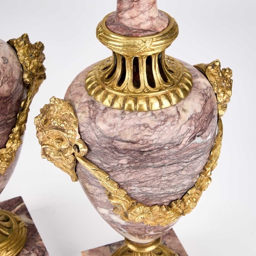 1079 - A PAIR OF FRENCH ORMOLU-MOUNTED MARBLE CASSOLETTES each domed 'cover' with a pine cone finial above ... 