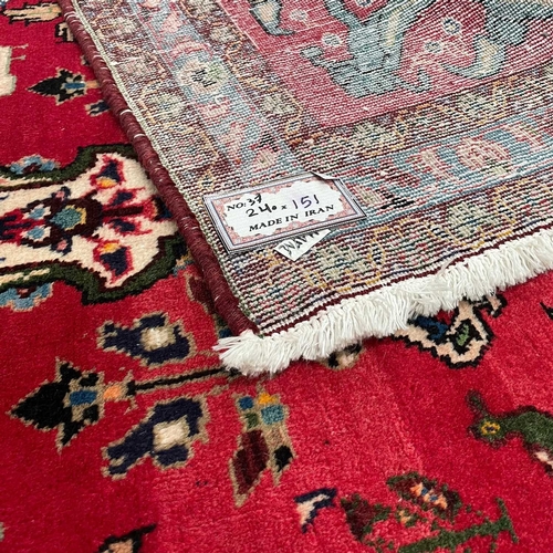 1231 - A PERSIAN LILLIAN CARPET, CIRCA 1960 240cm by 141cm