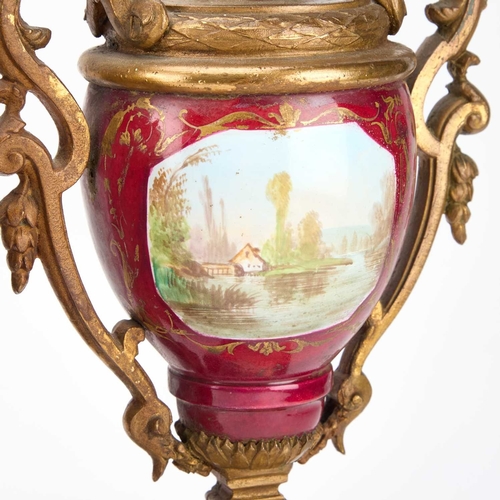 1246 - A LATE 19TH CENTURY FRENCH GILT-METAL AND MAGENTA-GROUND PORCELAIN CLOCK GARNITURE the clock elabora... 