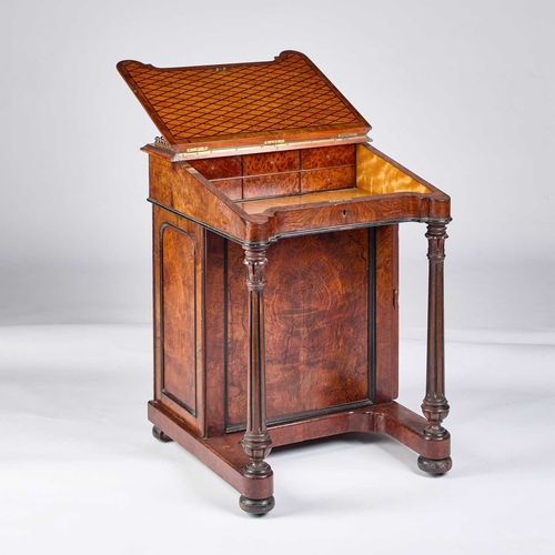 1260 - A VICTORIAN BURR WALNUT DAVENPORT fitted to one side with a cupboard door enclosing drawers, the sla... 