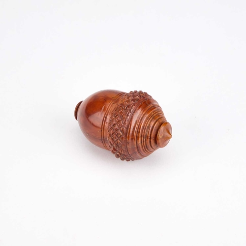 127 - A 19TH CENTURY COQUILLA NUTMEG GRATER in the form of an acorn. 7cm high