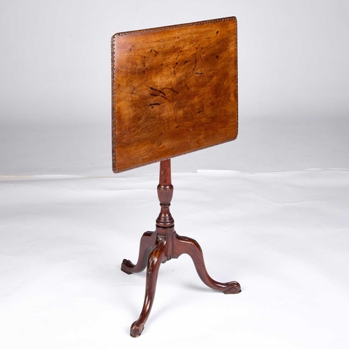 1287 - A GEORGE III MAHOGANY TILT-TOP TRIPOD TABLE the rectangular top raised on a slender stem continuing ... 