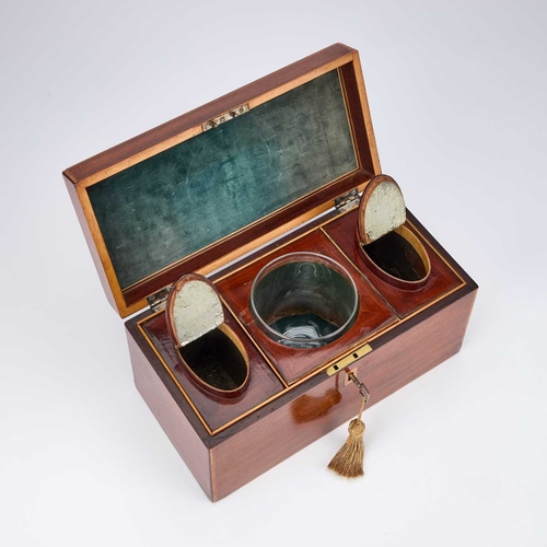 129 - A GEORGE III MAHOGANY TEA CADDY rectangular, satinwood banded and ebony strung, the hinged lid with ... 