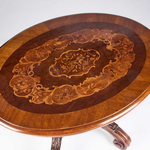 1293 - A 19TH CENTURY CONTINENTAL INLAID WALNUT CENTRE TABLE the oval top centred by a floral spray within ... 