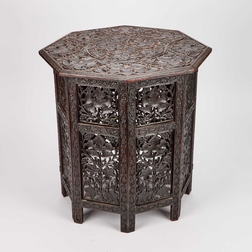 1323 - TWO 19TH CENTURY ANGLO-INDIAN CARVED TABLES the first square with everted corners and a shelf stretc... 