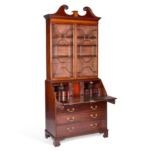 1335 - A GEORGE III MAHOGANY BUREAU BOOKCASE the upper section with a swan neck pediment and dentil cornice... 