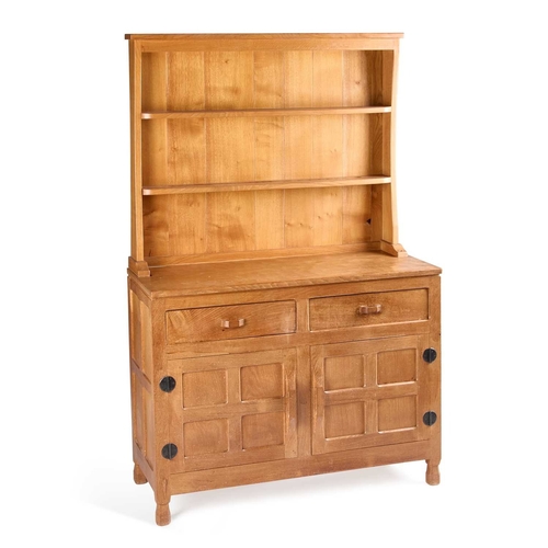 1361 - DEREK SLATER, A LIZARDMAN OAK DRESSER AND RACK the boarded rack with two shelves, the base with a pa... 