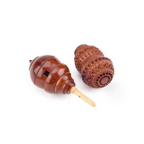 145 - A 19TH CENTURY CARVED COQUILLA NUT SPICE SHAKER together with a treen spinning top with a bone spind... 