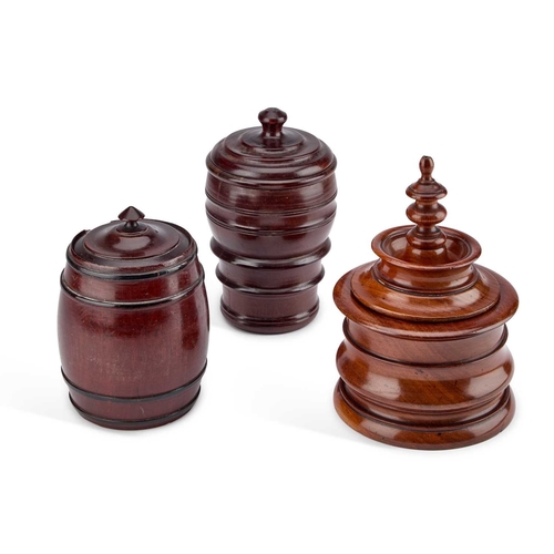 159 - A 19TH CENTURY MAHOGANY TOBACCO JAR AND COVER together with two further tobacco jars. (3) Tallest 20... 