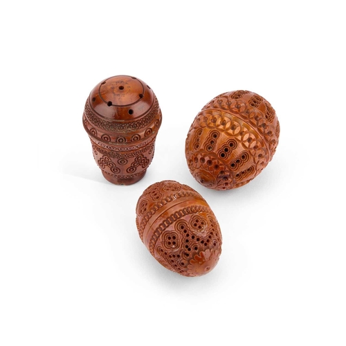 168 - THREE PIERCED AND CARVED COQUILLA NUTS comprising two flea traps and a pounce pot. (3) Pounce pot 6c... 