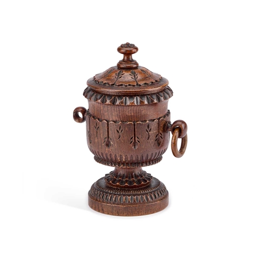 169 - A 19TH CENTURY CARVED OAK TOBACCO JAR AND COVER 23cm high