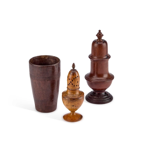 18 - TWO TREEN CASTERS OR MUFFINEERS together with an early 19th century goblet. (3) Tallest 20cm