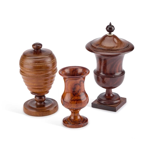 193 - A 19TH CENTURY TREEN COVERED URN together with a treen goblet and jar. (3) Tallest 24cm high