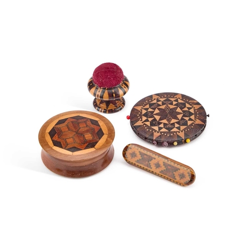 216 - FOUR PIECES OF TUNBRIDGE WARE comprising a brooch, a pin wheel, circular box and a pin cushion. (4) ... 