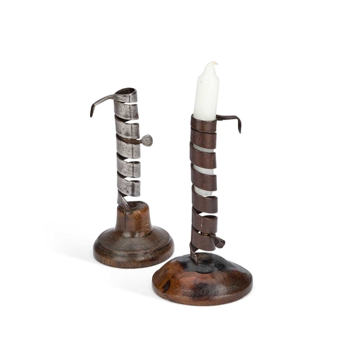 228 - TWO 18TH CENTURY RAT DE CAVE CANDLESTICKS each on a turned stained beech base, one marked LNA & ... 