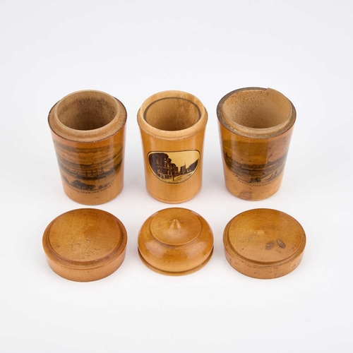 244 - THREE MAUCHLINE WARE GLASS HOLDERS each decorated with a titled and printed scene. (3) Tallest 8.5cm... 