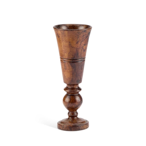 273 - A LARGE 19TH CENTURY TURNED TREEN GOBLET with a tapering bowl and knopped stem. 27.5cm high