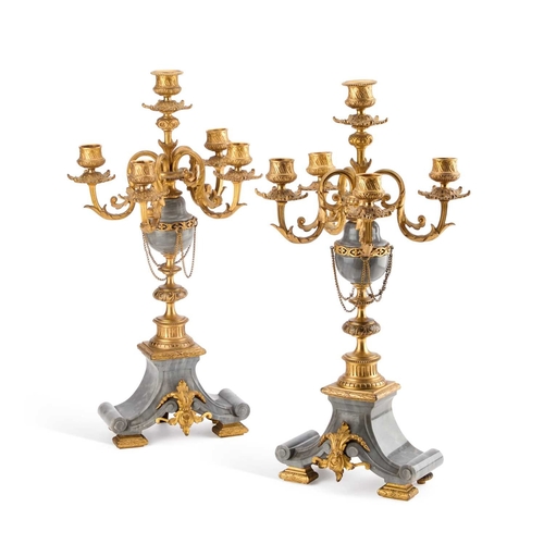 299 - A PAIR OF LOUIS XVI STYLE GREY MARBLE AND ORMOLU FIVE-LIGHT CANDELABRA each with four scroll-form le... 