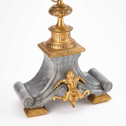 299 - A PAIR OF LOUIS XVI STYLE GREY MARBLE AND ORMOLU FIVE-LIGHT CANDELABRA each with four scroll-form le... 