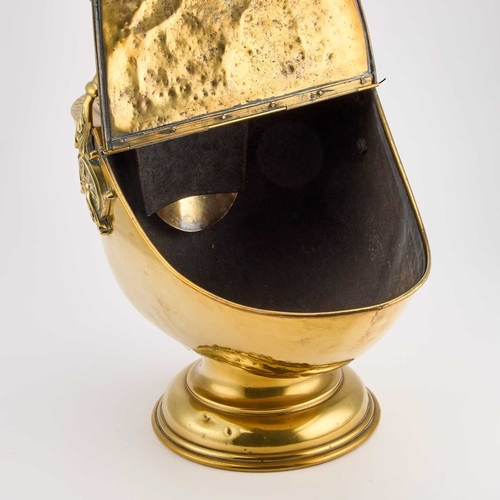 302 - A GOOD VICTORIAN BRASS COAL BUCKET helmet-shaped, complete with the original shovel, the handle with... 