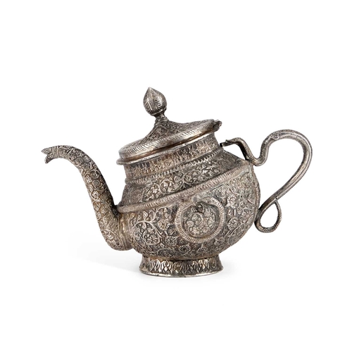 334 - AN INDAN KASHMIRI SILVER TEAPOT of tipped kang form, chased Kutch pattern with segments and floral f... 