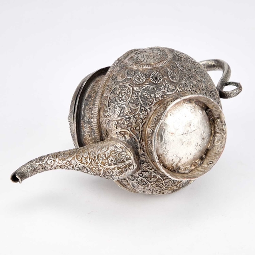 334 - AN INDAN KASHMIRI SILVER TEAPOT of tipped kang form, chased Kutch pattern with segments and floral f... 