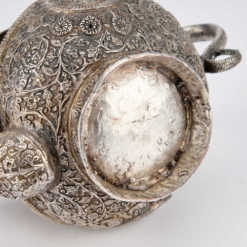 334 - AN INDAN KASHMIRI SILVER TEAPOT of tipped kang form, chased Kutch pattern with segments and floral f... 