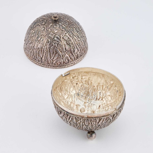 338 - AN EGYPTIAN SILVER STRING BOX unmarked, globular with three ball feet, densely chased with pharaohs,... 