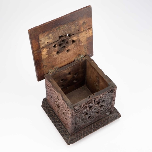 36 - AN 18TH CENTURY OAK CARRIAGE FOOT WARMER with carved and pierced decoration, raised on bun feet. 21c... 