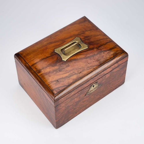 38 - A LARGE VICTORIAN WALNUT WORKBOX with a recessed engraved brass handle and escutcheon, containing a ... 