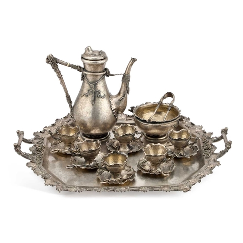 389 - Â§ AN AUSTRO-HUNGARIAN SILVER COFFEE SERVICE by BrÃ¼der Frank, Vienna, c.1900, in a rusticated tromp... 