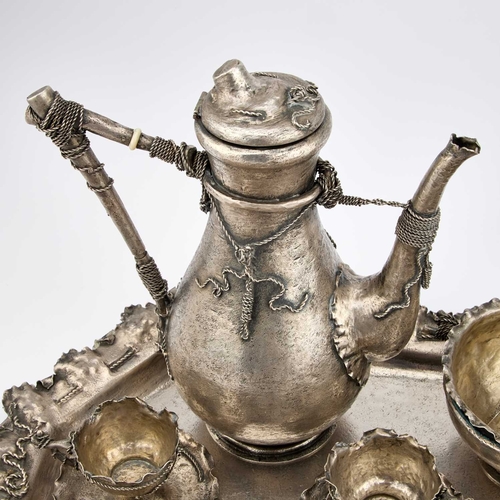 389 - Â§ AN AUSTRO-HUNGARIAN SILVER COFFEE SERVICE by BrÃ¼der Frank, Vienna, c.1900, in a rusticated tromp... 