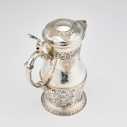 395 - A LATE 19TH CENTURY GERMAN SILVER JUG AND BEAKERS SET Hanau marks, the jug of baluster form with a h... 