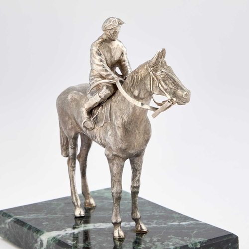 409 - AN ELIZABETH II SILVER MODEL OF A MOUNTED JOCKEY maker's mark illegible, London 1985, realistically ... 