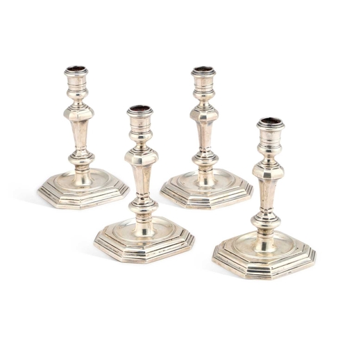 423 - FOUR ELIZABETH II SILVER CANDLESTICKS a pair by Carrington & Co, London 1968, the other pair by ... 