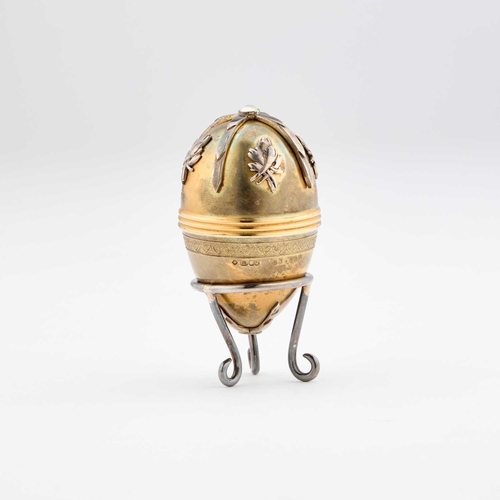 425 - A FABERGÃ STYLE PARCEL-GILT SILVER EGG by St James House Company, London 1982, the egg-shaped box o... 