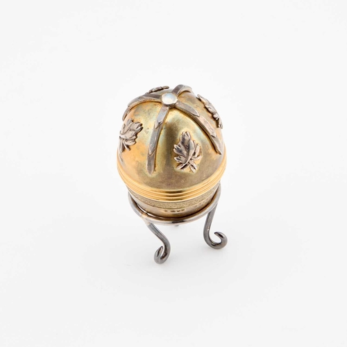 425 - A FABERGÃ STYLE PARCEL-GILT SILVER EGG by St James House Company, London 1982, the egg-shaped box o... 