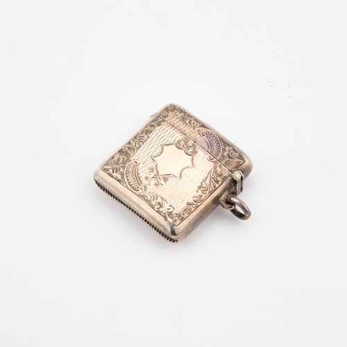 431 - AN EDWARDIAN SILVER VESTA CASE by Henry Matthews, Birmingham 1906, with foliate and bright-cut engra... 