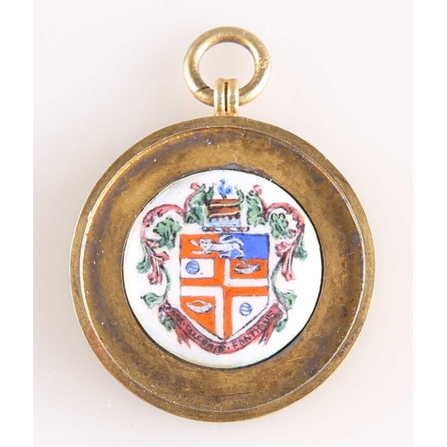 445 - A GEORGE V SILVER-GILT AND ENAMEL 'HARROGATE' FOB MEDALLION by Vaughton & Sons, Birmingham 1912,... 