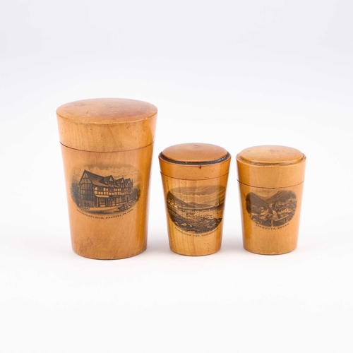 45 - THREE MAUCHLINE WARE GLASS HOLDERS each decorated with a titled and printed scene. (3) Tallest 7.5cm... 