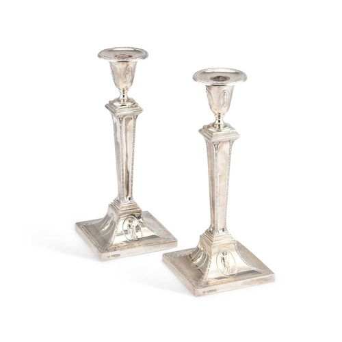 460 - A PAIR OF NEOCLASSICAL REVIVAL SILVER CANDLESTICKS by Hawksworth, Eyre & Co Ltd, Sheffield 1904,... 