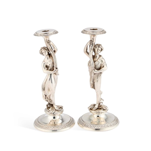 522 - A PAIR OF VICTORIAN SILVER FIGURAL CANDLESTICKS by S Smith & Son, London 1865, cast as a Bacchic... 