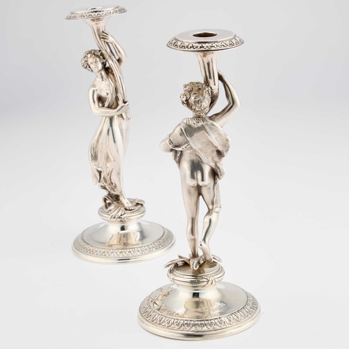 522 - A PAIR OF VICTORIAN SILVER FIGURAL CANDLESTICKS by S Smith & Son, London 1865, cast as a Bacchic... 