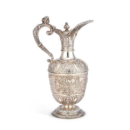 538 - A VICTORIAN SILVER CLARET JUG by Mappin & Webb Ltd, London 1901, after Cellini, chased with mask... 