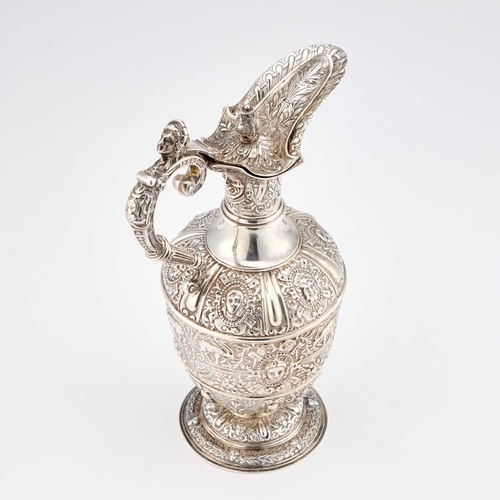 538 - A VICTORIAN SILVER CLARET JUG by Mappin & Webb Ltd, London 1901, after Cellini, chased with mask... 