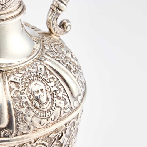 538 - A VICTORIAN SILVER CLARET JUG by Mappin & Webb Ltd, London 1901, after Cellini, chased with mask... 