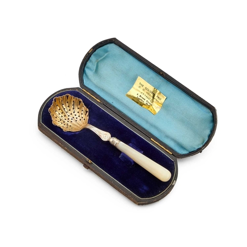 539 - A VICTORIAN SILVER SIFTING SPOON maker's mark rubbed, London 1884, with a mother-of-pearl handle and... 